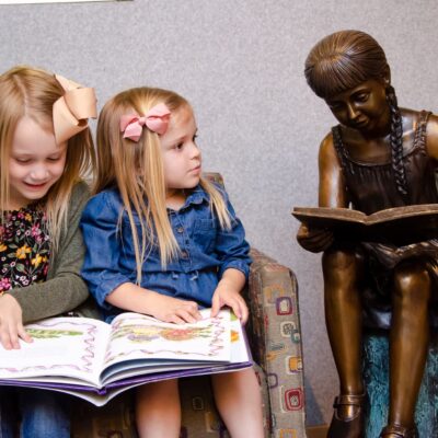 Little girls reading at the pediatric dental office